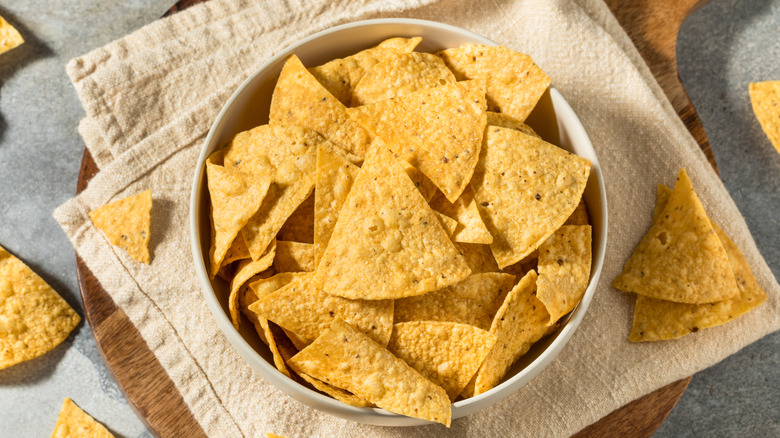 Bowl of tortilla chips on linen napkin