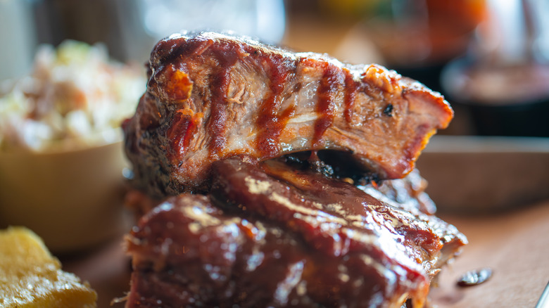 Barbecued pork ribs with sauce dripping down the top.