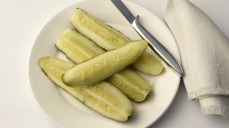 deli style pickle spears on plate