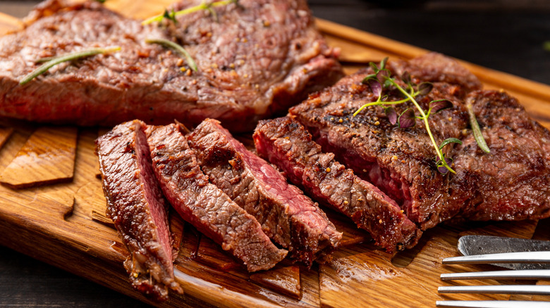 Close-up of sliced ribeye steak on a cutting board