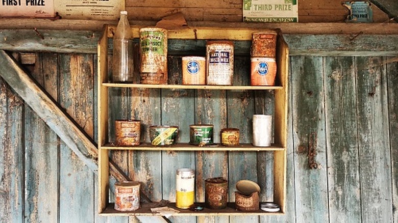 U.K. war ration cans on wooden shelves