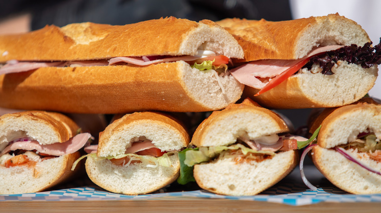 A table of multiple sub sandwiches