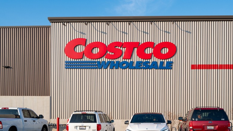 Cars parked outside a Costco storefront