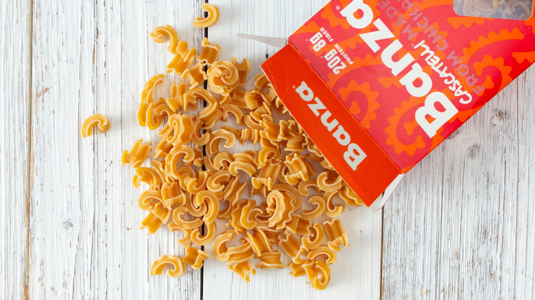 A spilled box of Banza noodles on table