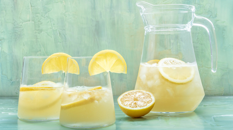 Pitcher and glasses of cold lemonade