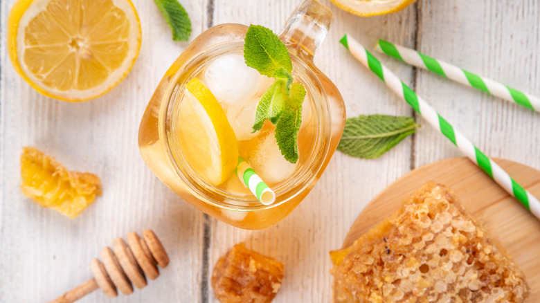 Top view of a jar of honey lemonade with mint garnish