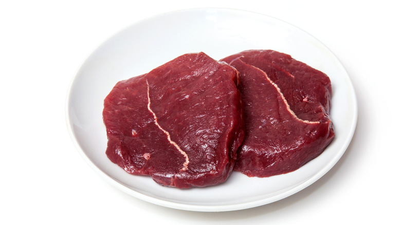 Zebra steaks on a plate.
