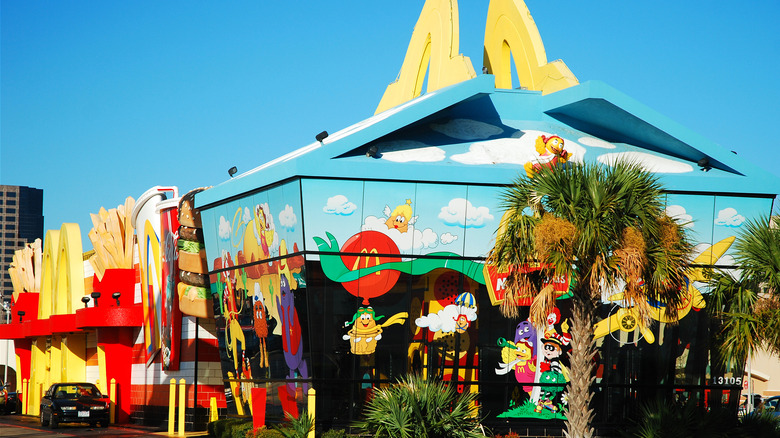 Happy Meal-shaped McDonald's building with McDonaldland characters painted on exterior
