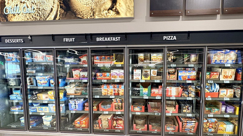 Frozen section at Aldi with signs for desserts, fruit, breakfast, and pizza