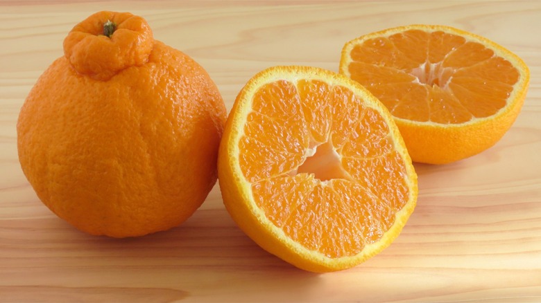 Sumo orange whole and cut in half