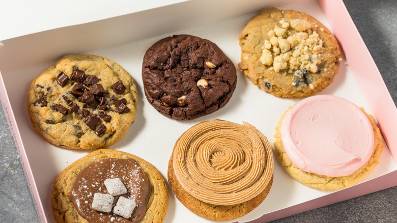 Six Crumbl cookies in a box