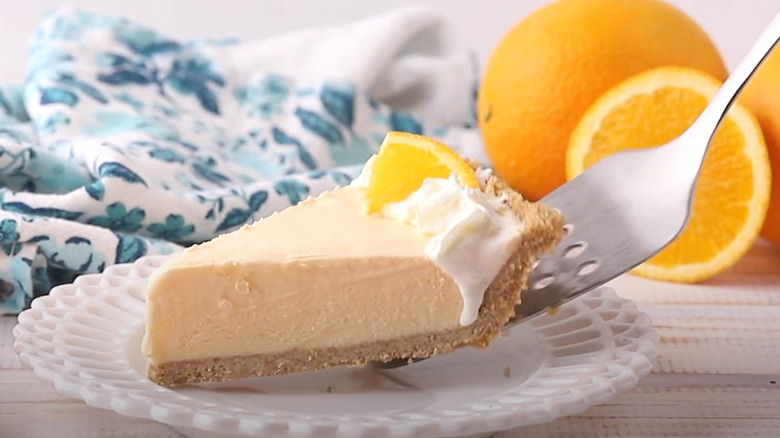 Orange icebox pie slice on spatula