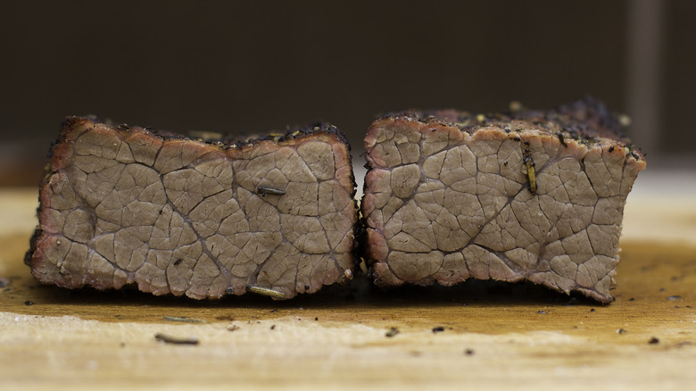 Overcooked and gray unappealing steak cross section.