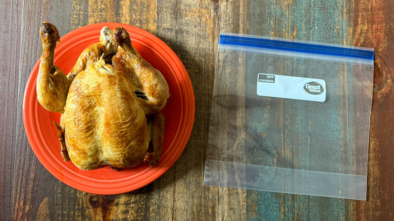 A full rotisserie chicken with a gallon-sized zip-top bag, ready to be hacked