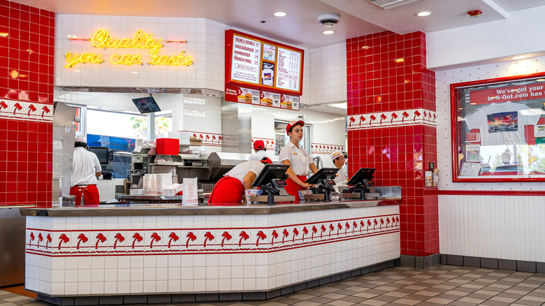 Employees standing behind the counter at In-N-Out