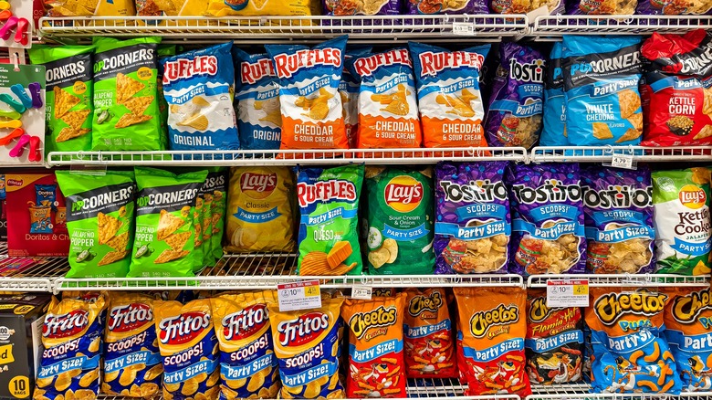 supermarket shelves with chips and other bagged snacks