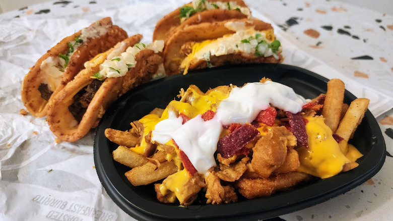 Taco Bell Chalupas beside an order of Nacho Fries