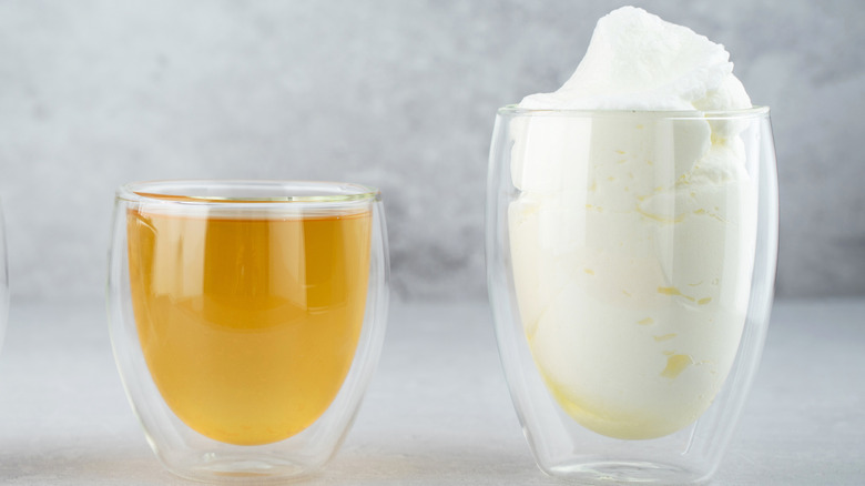Glass of aquafaba and glass of whipped aquafaba