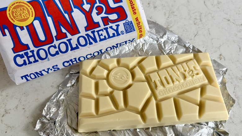 An unwrapped Tony's Chocolonely white chocolate bar