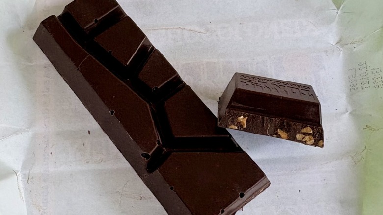 A broken off chunk of Tony's Chocolonely dark almond sea salt bar