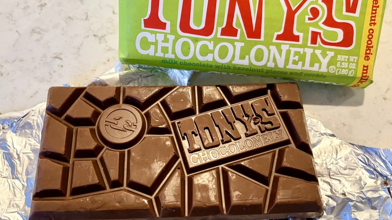 A Tony's Chocolonely milk hazelnut cookie bar unwrapped