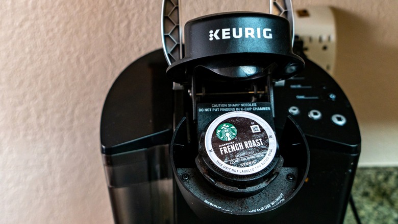 Keurig machine with Starbucks French Roast K-cup inside