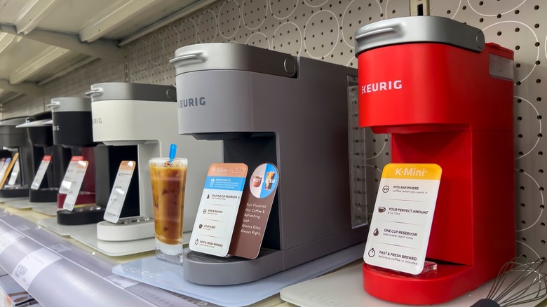 Different colored Keurig units on store shelf