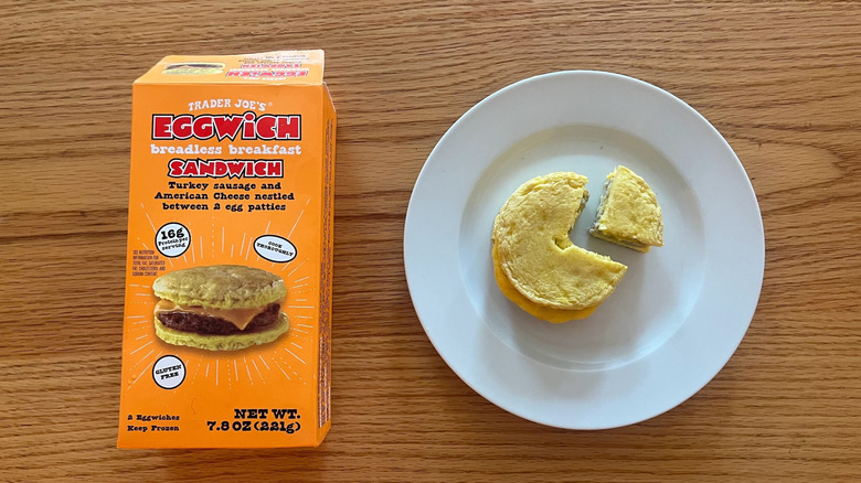 Eggwich Breadless Breakfast Sandwich on a plate with a slice out