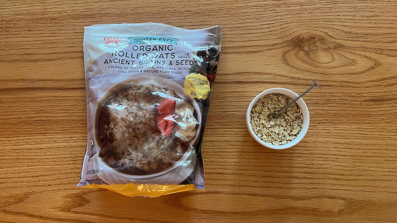 Organic Rolled Oats with Ancient Grains and Seeds in a bowl with a spoon