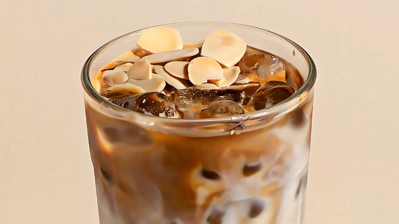Iced latte with slivered almonds on top