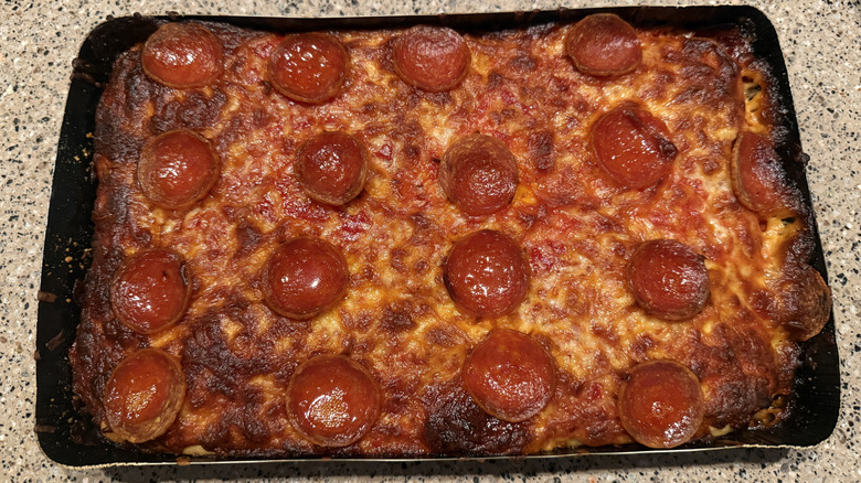 Cooked Trader Joe's Detroit Style Pepperoni Pizza on granite counter
