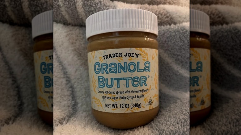 Jar of Trader Joe's granola butter spread on a fuzzy towel