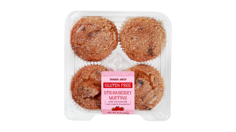 A 4-pack container of Trader Joe's Gluten Free Strawberry Muffins on a white background.