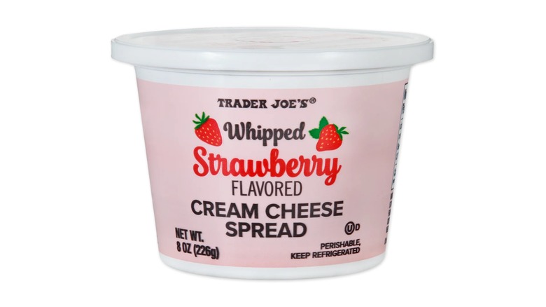 A tub of Trader Joe's Whipped Strawberry Cream Cheese on a white background.