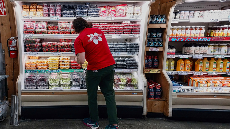 Trader Joe's employee stocking fruit