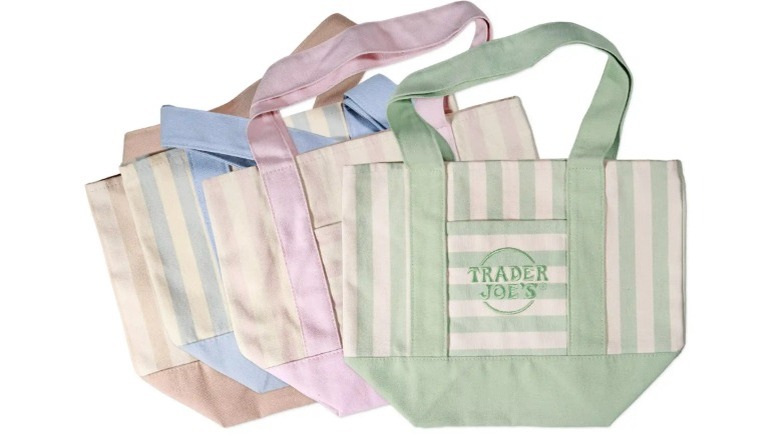 Trader Joe's mini tote bags in pastel green, pink, blue, and brown on a white background.