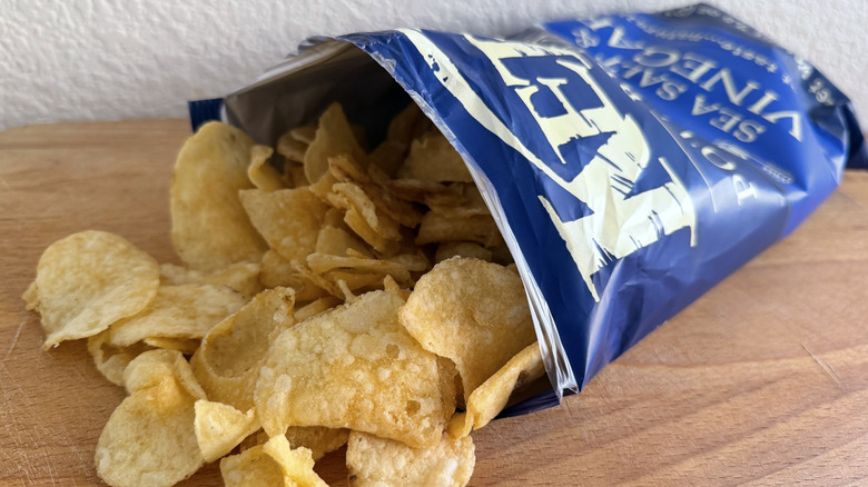 Kettle Chips bag spilling onto cutting board