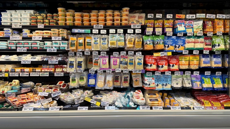 A wide shot of the cheese section at Trader Joe's.