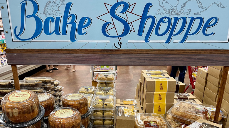 Trader Joe's baked goods section with sign and assorted products.