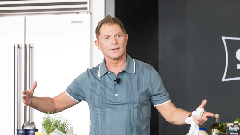 Bobby Flay on stage during cooking presentation
