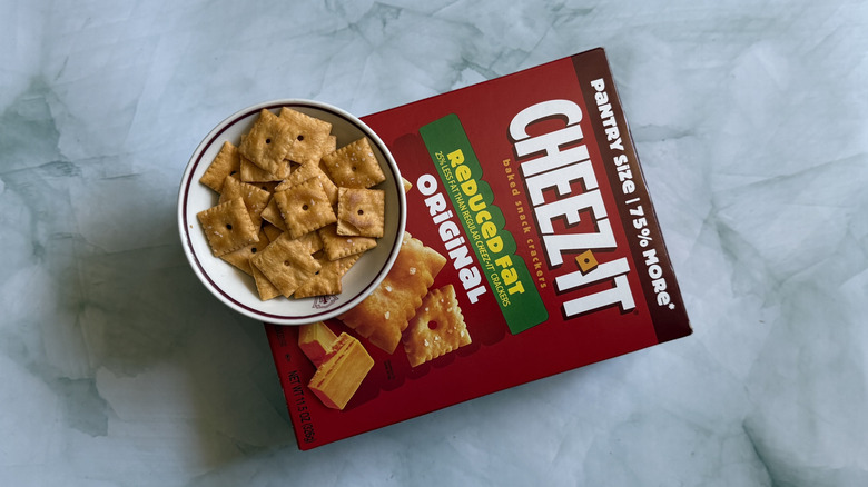 Box of Cheez-It Reduced Fat Snack Crackers under small bowl of the Cheez-Its