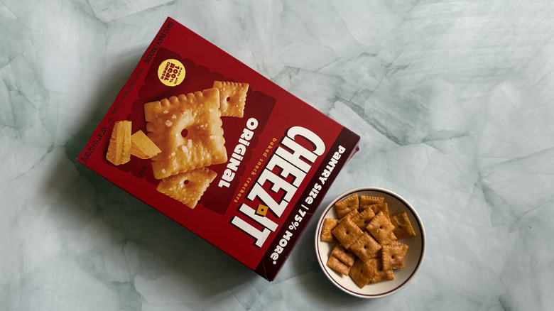 Box of Cheez-It Original Snack Crackers next to bowl of the Cheez-Its