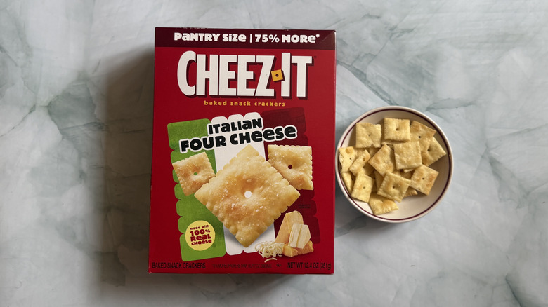 Box of Cheez-It Italian Four Cheese Snack Crackers next to bowl of the Cheez-Its