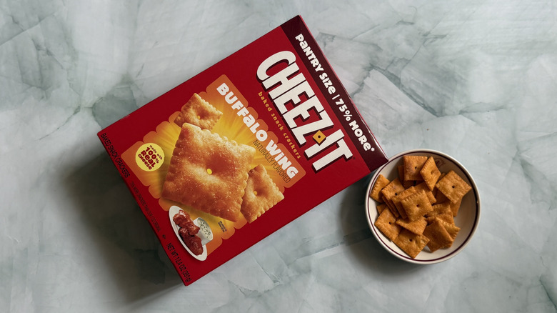 Box of Cheez-It Buffalo Wing Snack Crackers next to bowl of the Cheez-Its