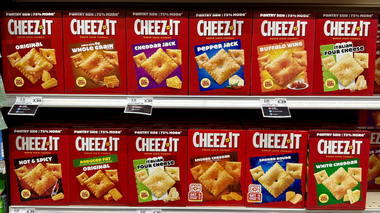 several boxes of different Cheez-It flavors on a shelf, including buffalo wing and pepper jack