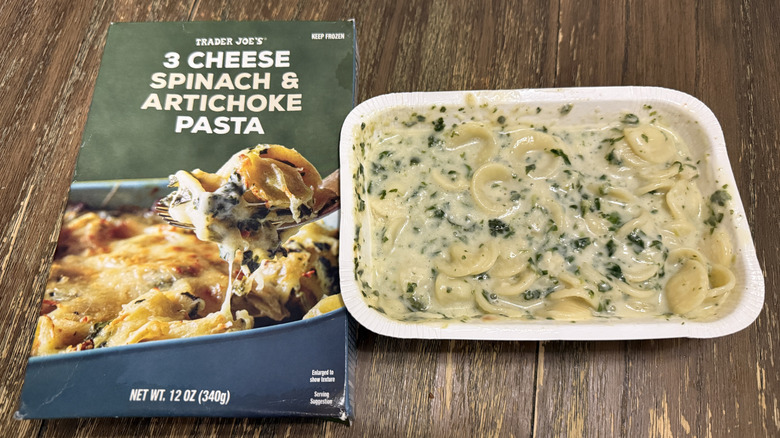 Trade Joe's 3 Cheese Spinach Artichoke Pasta cooked next to package