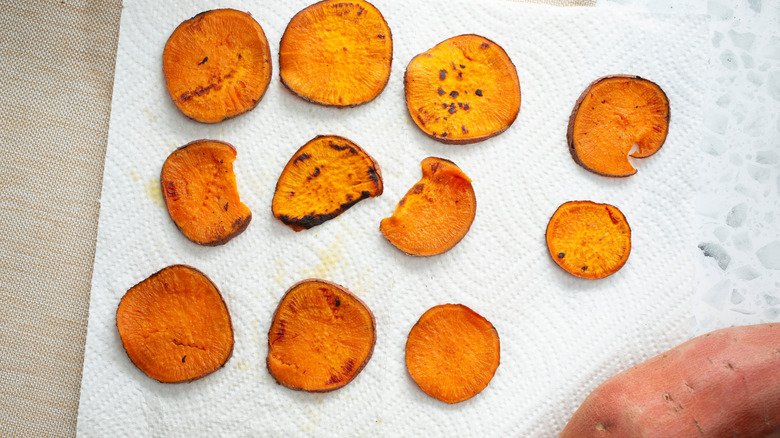 Homemade sweet potato chips on a paper towel