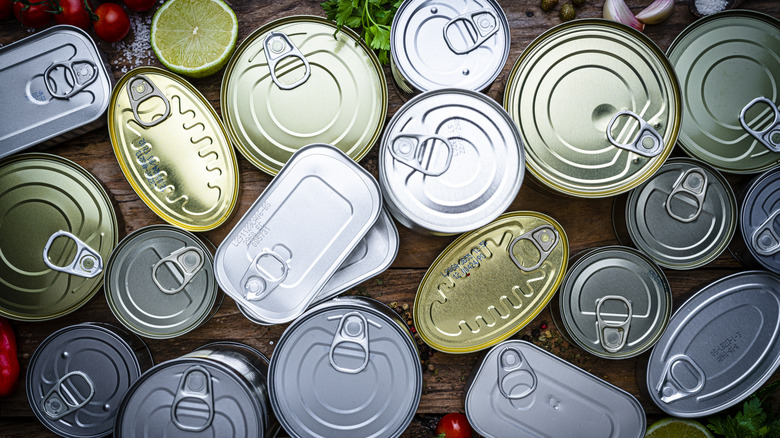 Top view of assorted unopened cans of seafood