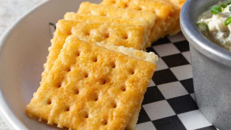 Toasty saltines on a plate.