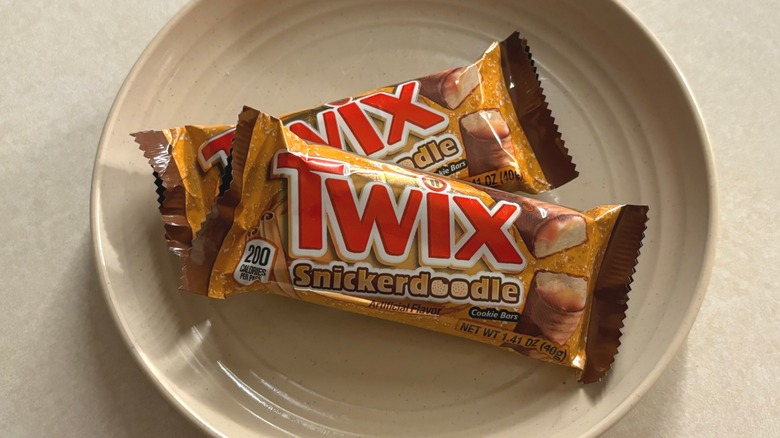 Two wrapped Twix Snickerdoodles on a plate